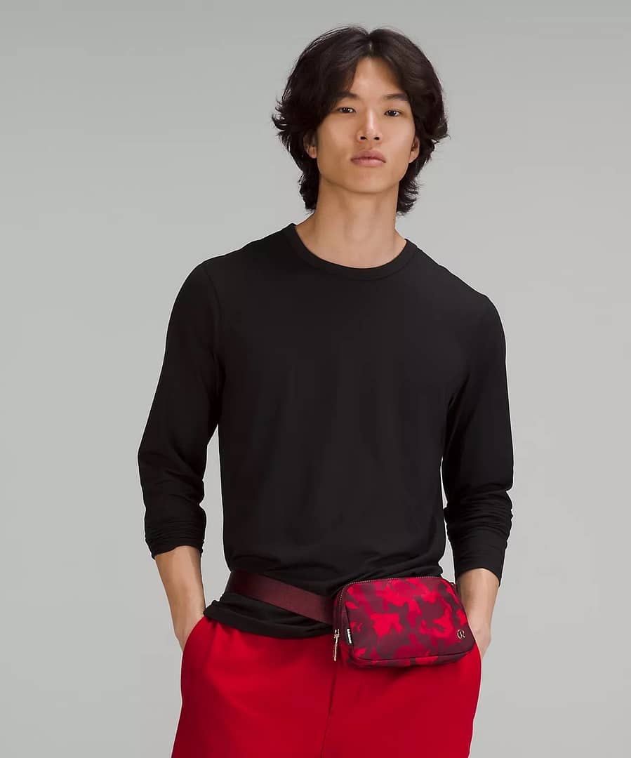 person wearing the New Year Everywhere Belt Bag 1L - rabbit all over print red multi - lululemon lunar new year belt bag
