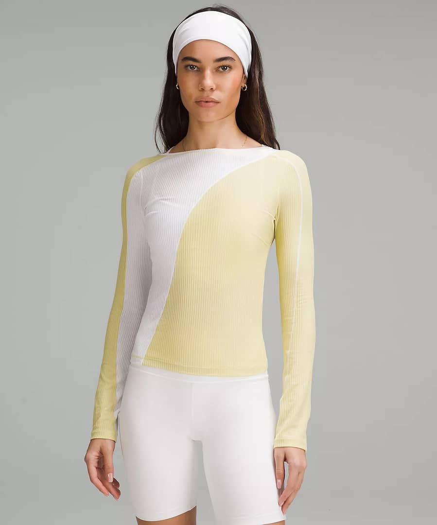 woman in Asymmetrical Ribbed Cotton Long-Sleeve Shirt in white and yellow