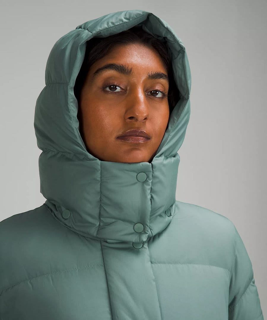 woman wearing teal Wunder Puff Waist Jacket from lululemon Restocks