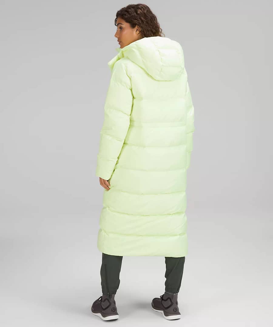 woman shwoing back details of Wunder Puff Long Jacket with faded zap from lululemon restock