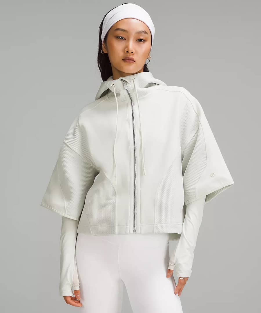 woman in Mixed Fabric Full-Zip Hoodie and white pants cycling shorts to pair with Scuba Oversized Half-Zip Hoodie