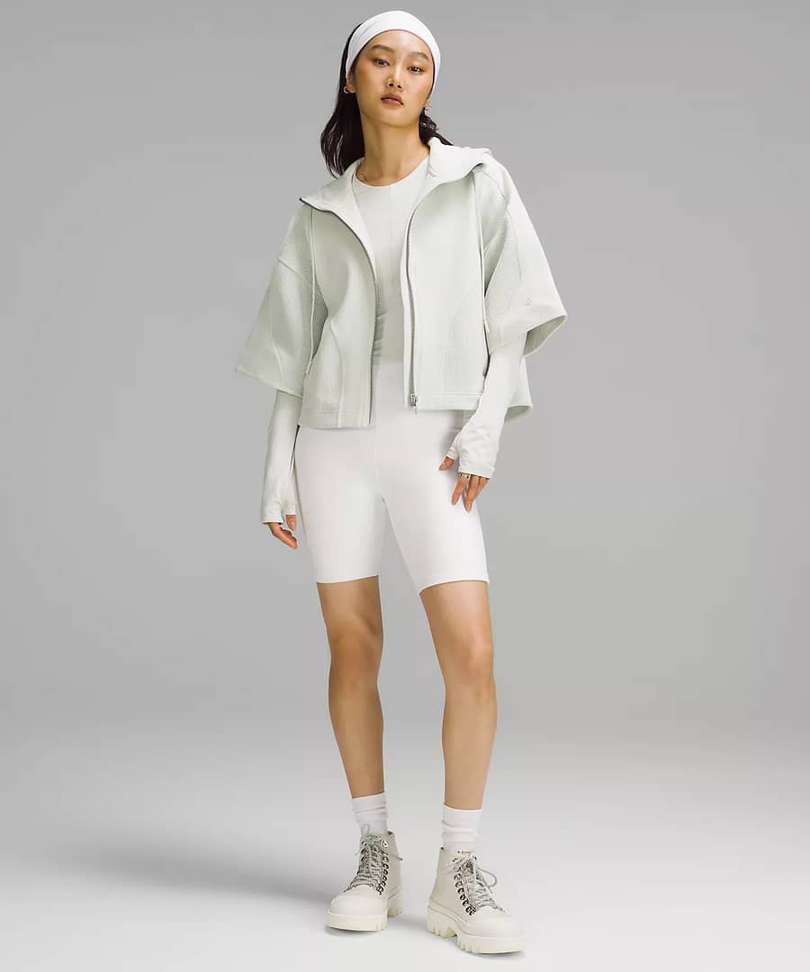 Mixed Fabric Full-Zip Hoodie and white pants cycling shorts to pair with Scuba Oversized Half-Zip Hoodie worn by a woman