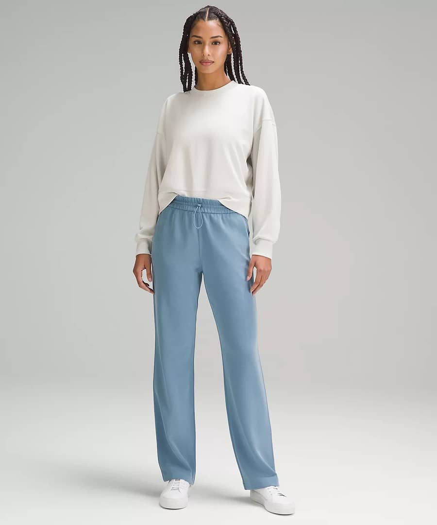 woman in white top and high-rise pants from the from the lululemon Early-Access