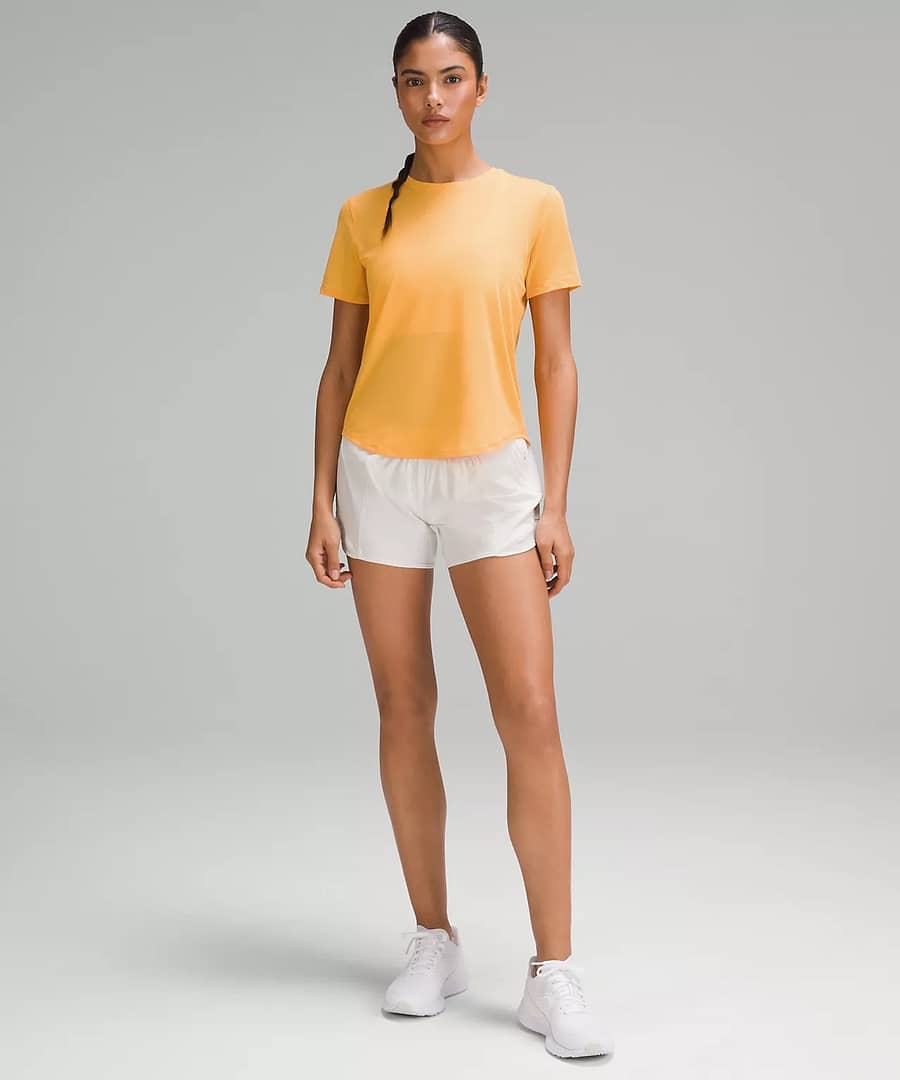 woman in High-Neck Running and Training T-Shirt - mango dream for Lululemon weekly product drop