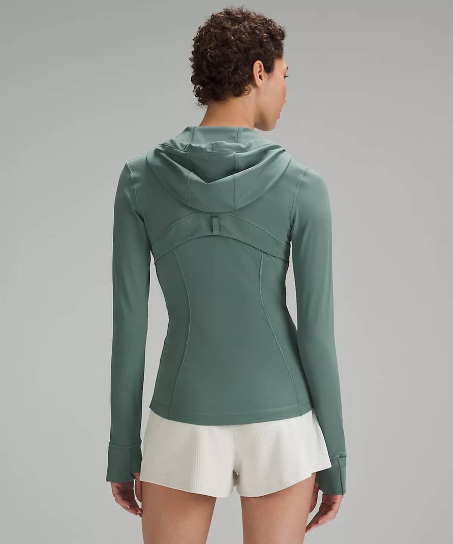 woman Fashionably Fit with Lululemon wearing Hooded Define Jacket Nulu medium showing back details