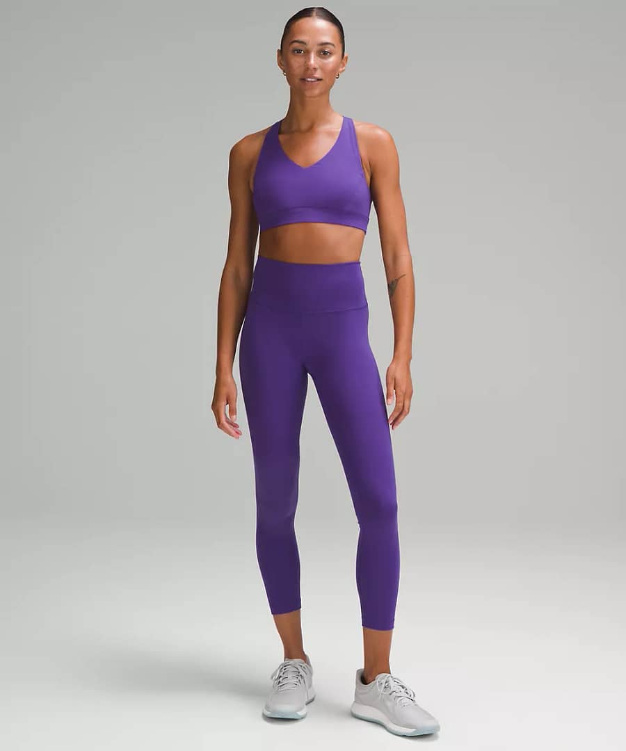 woman Fashionably Fit with Lululemon Wunder Train High-Rise Tight 25" petrol purple top and bottoms