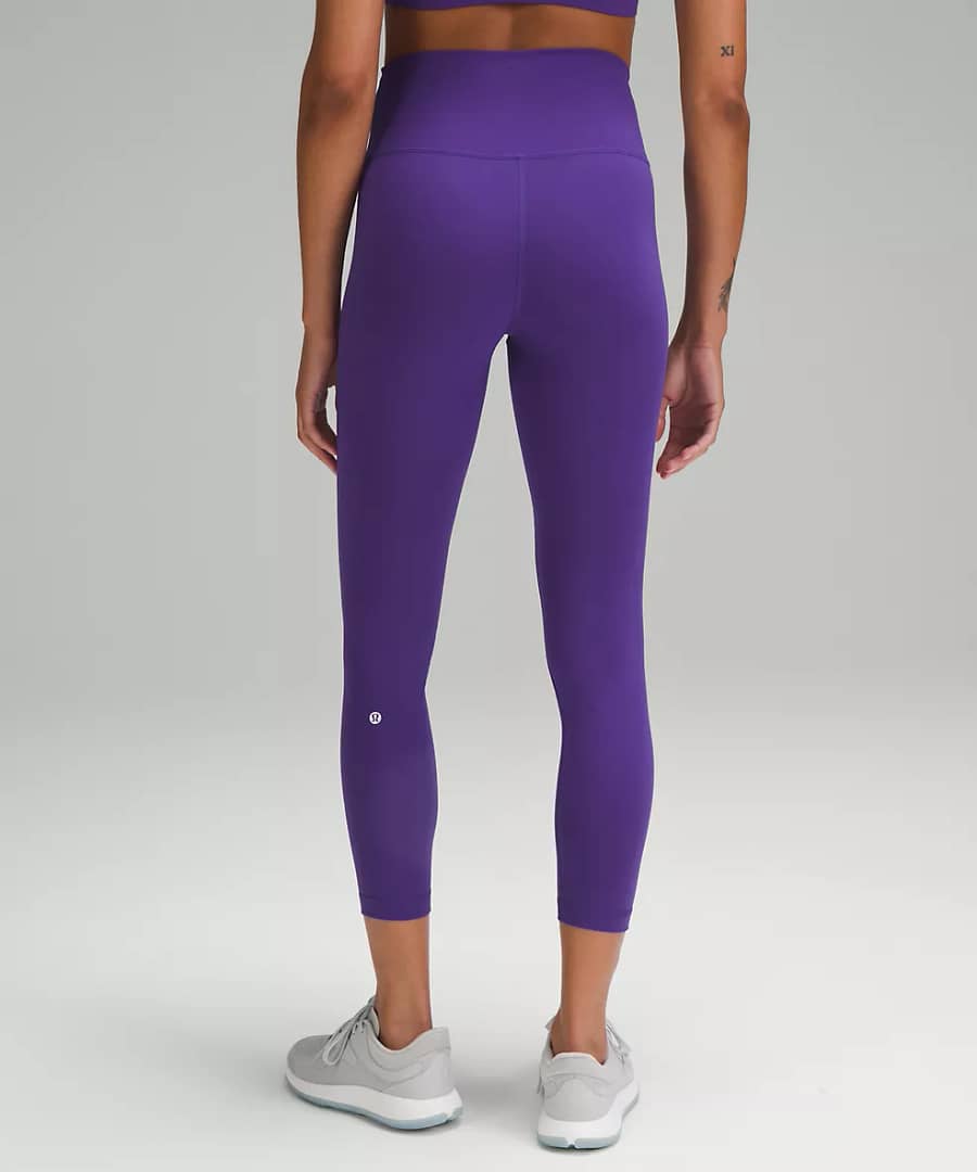 woman Fashionably Fit with Lululemon Wunder Train High-Rise Tight 25" petrol purple back details