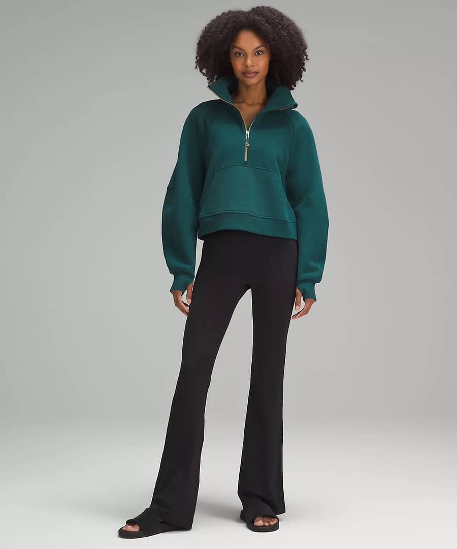woman showing the details of the Scuba Oversized Funnel Neck Half Zip from the lululemon upload