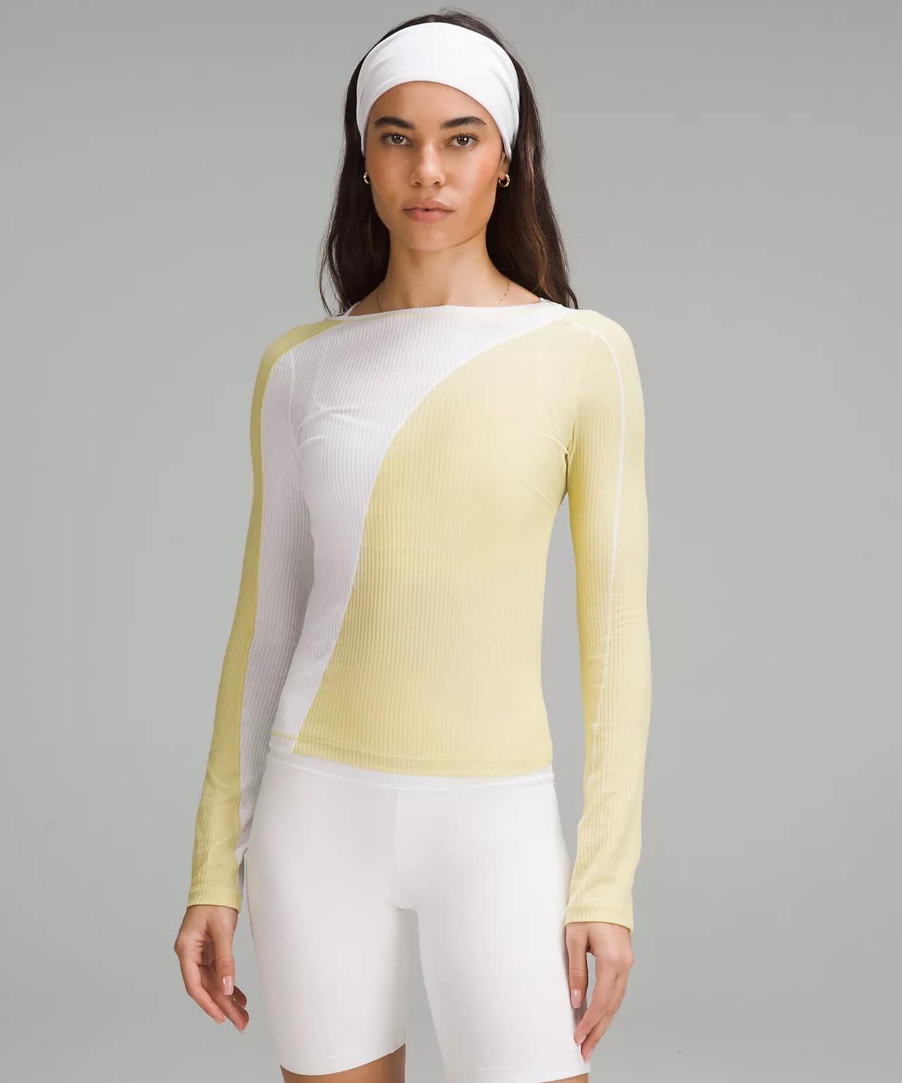 woman in Asymmetrical Ribbed Cotton Long-Sleeve Shirt in white and yellow