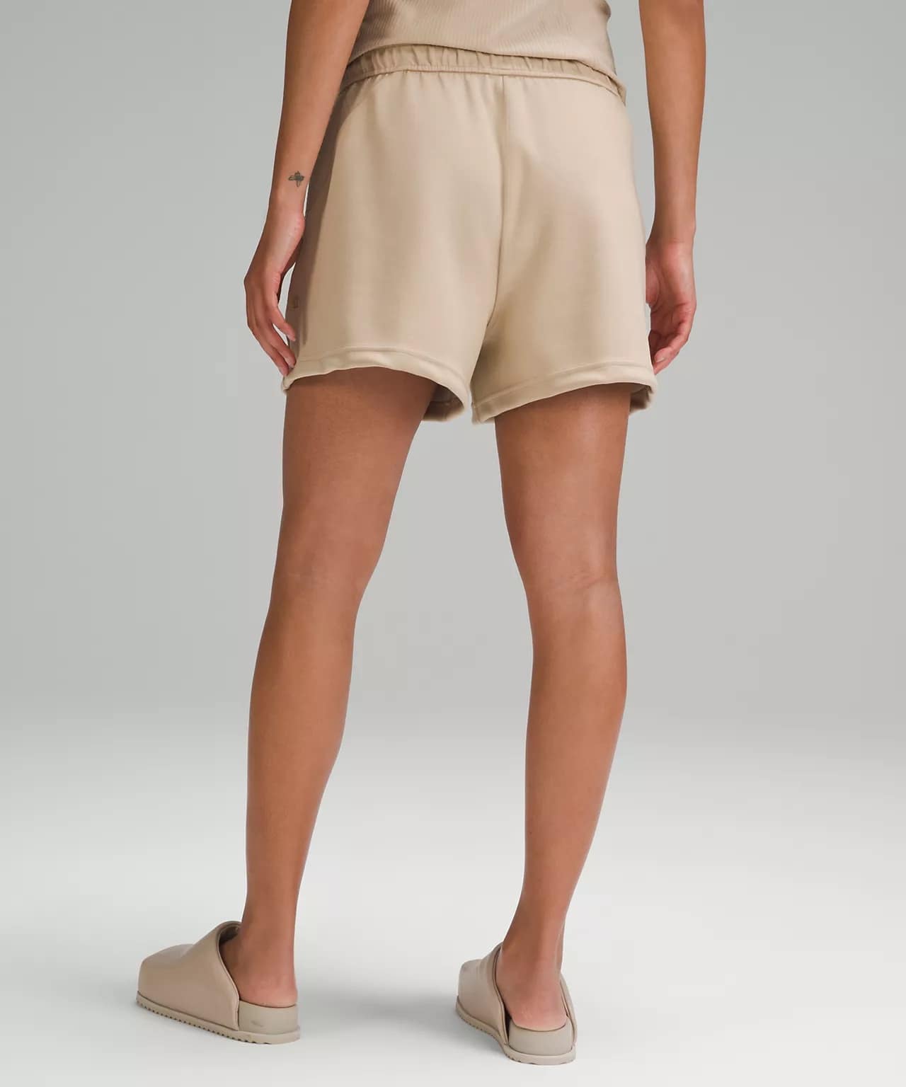 back details of Embossed Panel High-Rise Short lululemon shorts in beige
