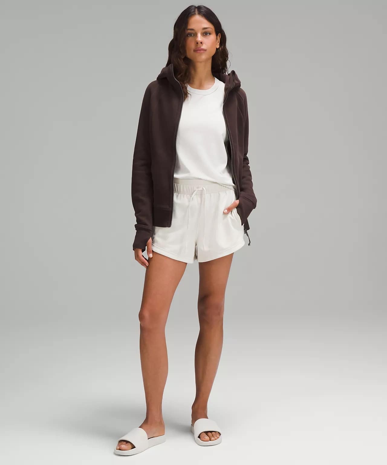 woman wearing Scuba Full-Zip Hoodie espresso and white lululemon shorts