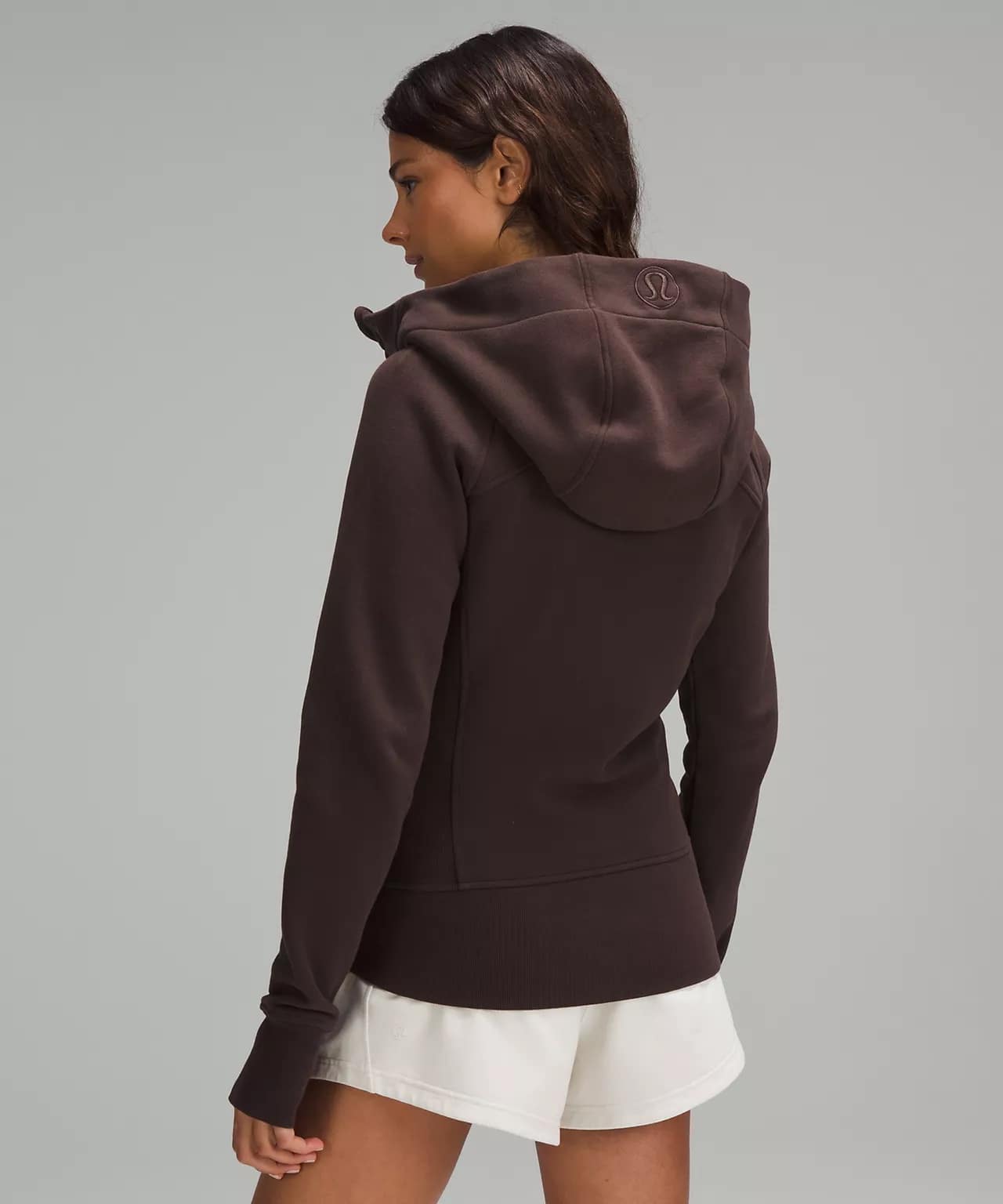 back details of woman wearing Scuba Full-Zip Hoodie espresso and white lululemon shorts
