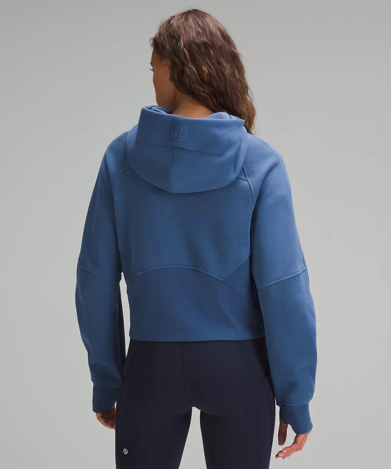 woman wearing Scuba Oversized Half-Zip Hoodie - pitch blue back details and lullulemon shorts